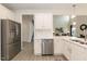 Bright kitchen with stainless steel appliances, white cabinetry, and an open layout at 62 Faircox Way # 139, Garner, NC 27529