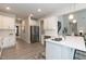 Modern kitchen with white cabinets, stainless steel appliances, and a kitchen island at 62 Faircox Way # 139, Garner, NC 27529