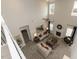 Aerial view of a well-lit living room with a fireplace, high ceilings, and comfortable seating at 62 Faircox Way # 139, Garner, NC 27529