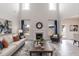 Bright living room with a fireplace, large windows, and comfortable seating at 62 Faircox Way # 139, Garner, NC 27529