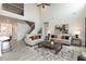 Spacious living room featuring modern decor, high ceilings, and a staircase at 62 Faircox Way # 139, Garner, NC 27529