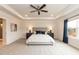 Spacious bedroom features a tray ceiling, large window with curtains, and neutral carpet at 62 Faircox Way # 139, Garner, NC 27529