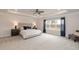 Spacious main bedroom features a tray ceiling, large window, and neutral carpet at 62 Faircox Way # 139, Garner, NC 27529
