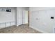 Organized mudroom with built-in shelving, coat hooks, and access to laundry hookups at 62 Faircox Way # 139, Garner, NC 27529