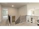 Hallway with carpeted stairs and decorative metal art at 62 Faircox Way # 139, Garner, NC 27529