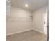 Walk-in closet with shelving and neutral carpet at 62 Faircox Way # 139, Garner, NC 27529