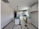 Modern kitchen with white cabinets and a breakfast bar at 65 Barony Ln, Smithfield, NC 27577