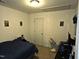 Simple bedroom with a bed, fan, and posters at 670 Meadowtop Cir, Burlington, NC 27217