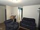Living room with two blue reclining sofas at 670 Meadowtop Cir, Burlington, NC 27217