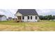 New construction featuring a backyard with level, partially-landscaped lawn at 71 Priming Way, Angier, NC 27501