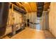 Unfinished basement space featuring exposed wood beams and insulation at 71 Priming Way, Angier, NC 27501