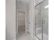Marble bathroom with walk-in shower and view into large walk-in closet at 71 Priming Way, Angier, NC 27501