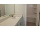 Well-lit bathroom featuring sleek countertops and a combined tub and shower with shelving at 71 Priming Way, Angier, NC 27501