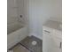 This bathroom features a tub, shower, and a modern vanity with light countertops at 71 Priming Way, Angier, NC 27501