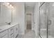 Neutral bathroom with a marble walk-in shower and and vanity sinks at 71 Priming Way, Angier, NC 27501