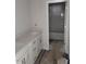 Bathroom with a vanity and modern countertops, featuring a view to the tub and shower at 71 Priming Way, Angier, NC 27501