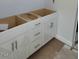 Bathroom showcasing unfinished white cabinetry, offering a clean and customizable space at 71 Priming Way, Angier, NC 27501