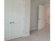 Bright bedroom featuring neutral carpeting and a large closet for ample storage solutions at 71 Priming Way, Angier, NC 27501
