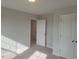 Spacious bedroom with plush carpet, neutral tones, and ample closet space for storage solutions at 71 Priming Way, Angier, NC 27501