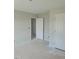 A spacious bedroom with neutral paint, featuring multiple door entryways and trim at 71 Priming Way, Angier, NC 27501