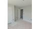 Unfinished bedroom with neutral walls, white trim, and a closet provides a blank canvas at 71 Priming Way, Angier, NC 27501
