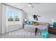 Bright bedroom featuring neutral colors, ceiling fan, day bed and fun wall graphic at 71 Priming Way, Angier, NC 27501