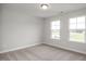 A spacious bedroom with two large windows providing ample natural light at 71 Priming Way, Angier, NC 27501