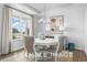 Bright dining room featuring a modern chandelier and large windows overlooking the yard at 71 Priming Way, Angier, NC 27501