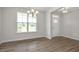 Inviting entryway featuring new hard wood floors, large windows, modern lighting and neutral paint at 71 Priming Way, Angier, NC 27501