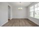 Inviting entryway featuring new hard wood floors, large windows, modern lighting and neutral paint at 71 Priming Way, Angier, NC 27501