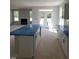 Bright kitchen with an island, white cabinets, and natural light, offering a modern and inviting space at 71 Priming Way, Angier, NC 27501