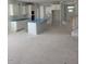 Spacious kitchen with island and white cabinets under construction at 71 Priming Way, Angier, NC 27501