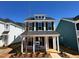 Charming two-story home with black shutters, a welcoming porch, and manicured landscaping at 712 Georgias Landing Pkwy # 13, Raleigh, NC 27603