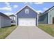 Detached garage with a white door and concrete driveway at 720 Georgias Landing Pkwy # 11, Raleigh, NC 27603