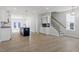 Spacious open-concept living area with hardwood floors, open kitchen, and natural light at 720 Georgias Landing Pkwy # 11, Raleigh, NC 27603