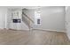 Open-concept living area featuring hardwood floors, stylish kitchen, and bright natural light at 720 Georgias Landing Pkwy # 11, Raleigh, NC 27603