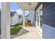 Covered patio view with white columns, ceiling fan, and yard views at 720 Georgias Landing Pkwy # 11, Raleigh, NC 27603