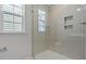Walk in shower with new tile, glass door, rainfall shower head and built in niche at 720 Georgias Landing Pkwy # 11, Raleigh, NC 27603