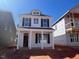 New construction home featuring a classic design with large windows and inviting front porch at 731 Georgia'S Landing Pkwy # 111, Raleigh, NC 27603