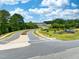 Landscaped entry to Georgia's Landing community with winding roads and green spaces at 731 Georgia'S Landing Pkwy # 111, Raleigh, NC 27603