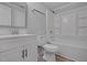 Clean bathroom with white vanity, toilet and shower bathtub combo at 7516 Fox Rd, Raleigh, NC 27616