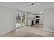 Modern kitchen with stainless steel appliances and light wood flooring at 7516 Fox Rd, Raleigh, NC 27616