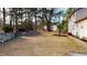 Spacious backyard with stone retaining wall at 7607 Divot Dr, Sanford, NC 27332