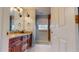 Bathroom with granite countertops, double sinks, and shower at 7607 Divot Dr, Sanford, NC 27332