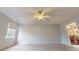 Main bedroom with ceiling fan and en-suite bathroom access at 7607 Divot Dr, Sanford, NC 27332