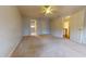 Spacious bedroom with ceiling fan and access to the bathroom at 7607 Divot Dr, Sanford, NC 27332