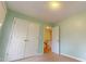 Well-lit bedroom with double doors leading to additional space at 7607 Divot Dr, Sanford, NC 27332