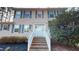 Two-story house with gray shutters and brick steps at 7607 Divot Dr, Sanford, NC 27332