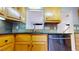 Kitchen features a large sink, dishwasher, and stylish tile backsplash at 7607 Divot Dr, Sanford, NC 27332