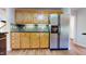 Kitchen boasts wood cabinets, granite countertops, and stainless steel appliances at 7607 Divot Dr, Sanford, NC 27332